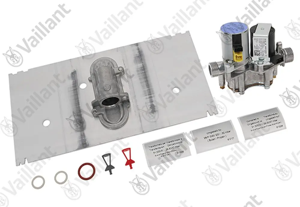Vaillant Umstellsatz mit einem Metallblech, einem Ventil und verschiedenen Dichtungen, geeignet für Heizungsanwendungen. Teile auf einem neutralen Hintergrund angeordnet.